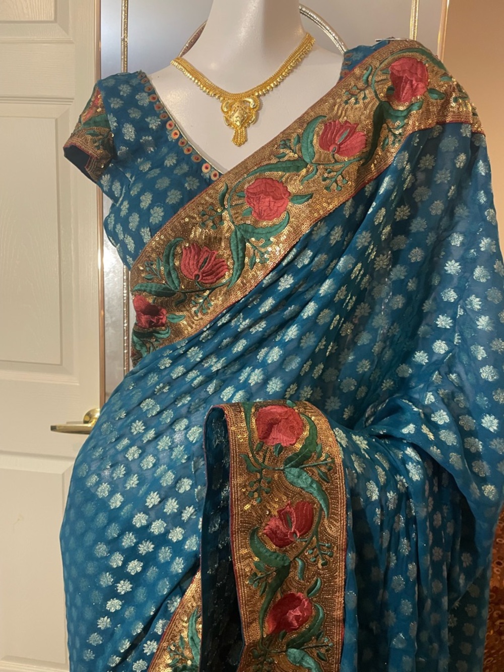 Teal Blue Embroidered Floral Saree with Gold Border